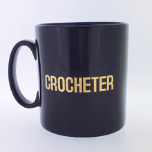 Load image into Gallery viewer, Mug - KNITTER, YARNIVORE or CROCHETER Black Mug with Gold Font